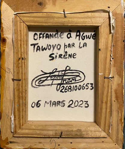 Wooden frame with a piece of paper containing text and a signature.